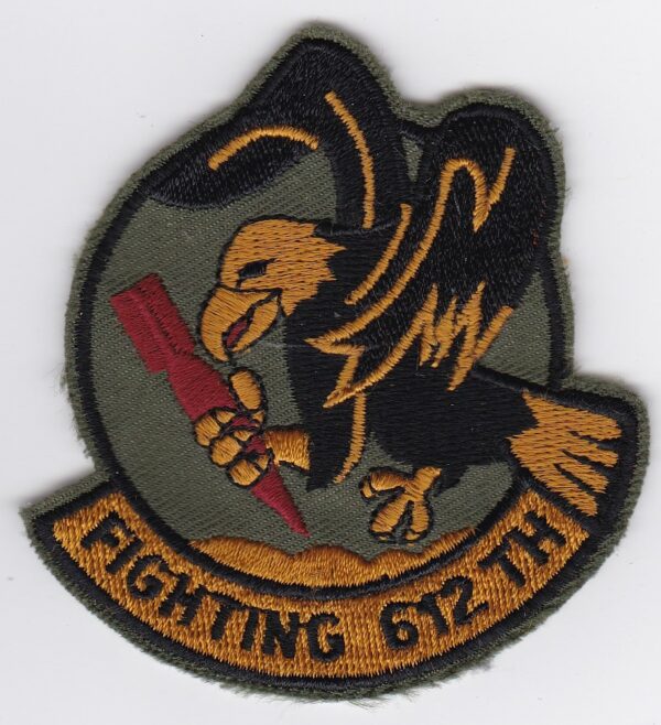 A patch with an eagle and a gun.