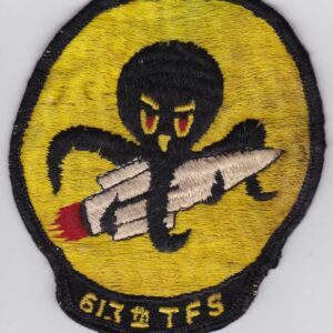 A patch with an octopus holding a rocket.