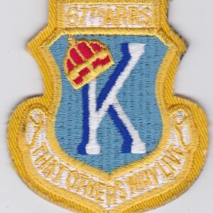 A patch with the letter k on it.