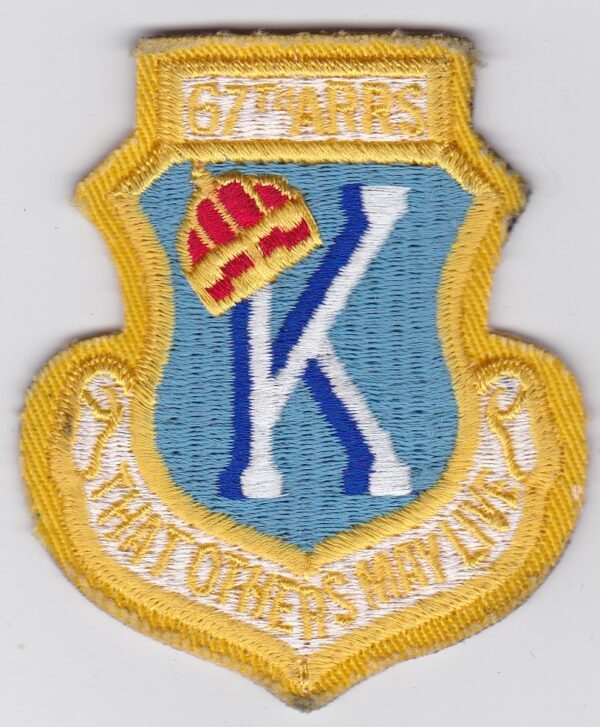 A patch with the letter k on it.