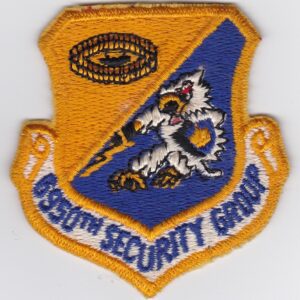 An air force security group patch on a white surface.