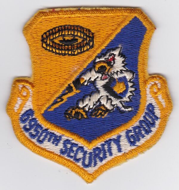 An air force security group patch on a white surface.