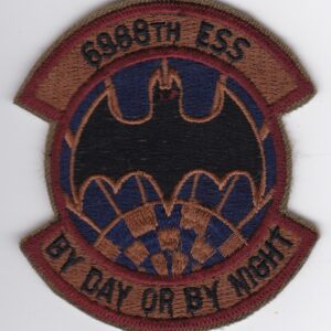 A patch with the words rb8th ess by day or night.