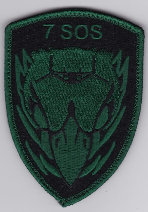 A green patch with the words 7 sos on it.