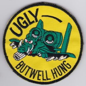 A patch with the words ugly butwell hung on it.