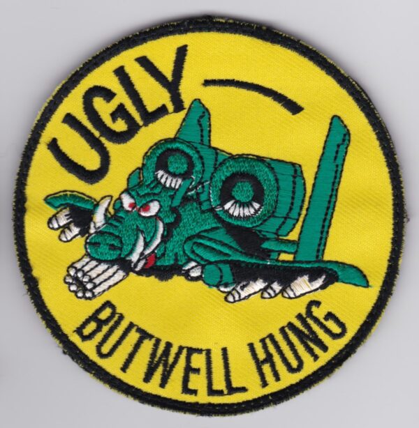 A patch with the words ugly butwell hung on it.