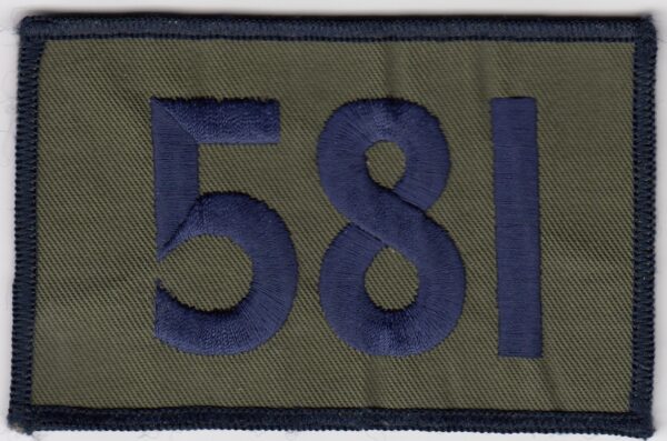 A patch with the number 581 on it.