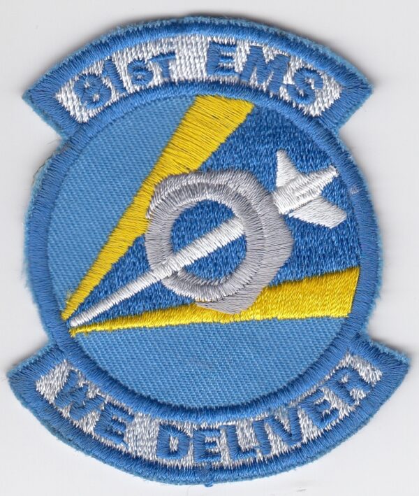 A blue and yellow patch with the words sme 18 we deliver.