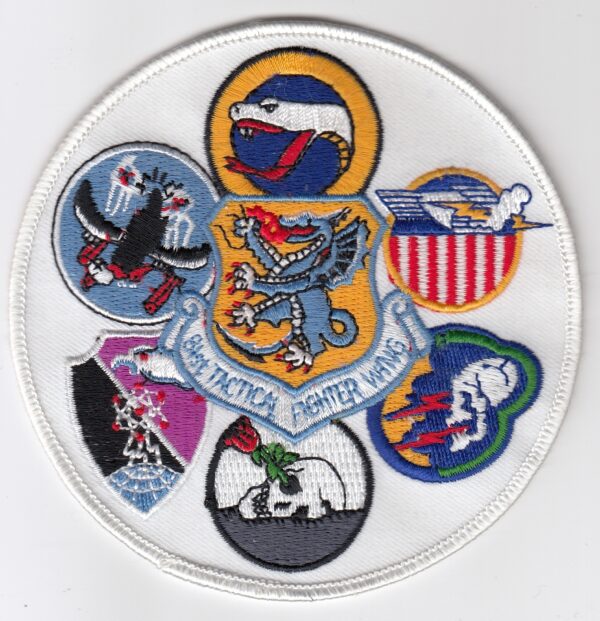 A round patch with various air force emblems on it.