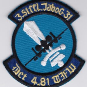 A patch with a blue and white logo on it.