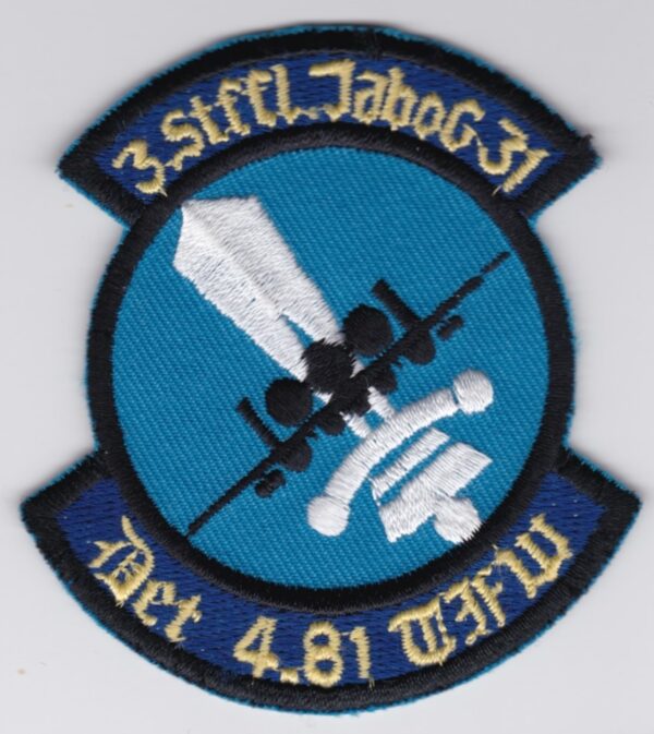 A patch with a blue and white logo on it.