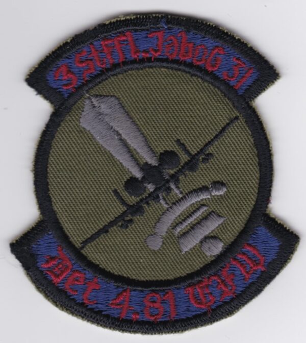 A patch with an image of a plane and a sword.