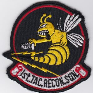 A patch with an image of a bee on it.