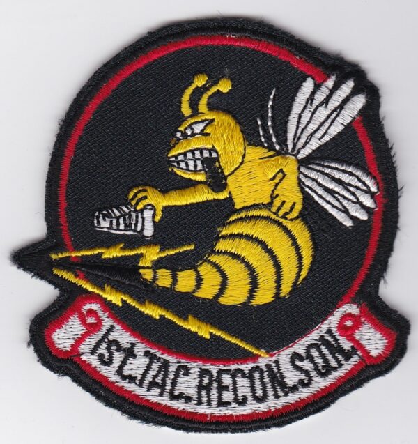 A patch with an image of a bee on it.