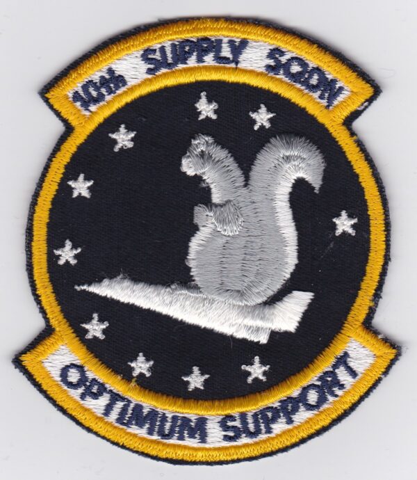 An embroidered patch with a squirrel on it.