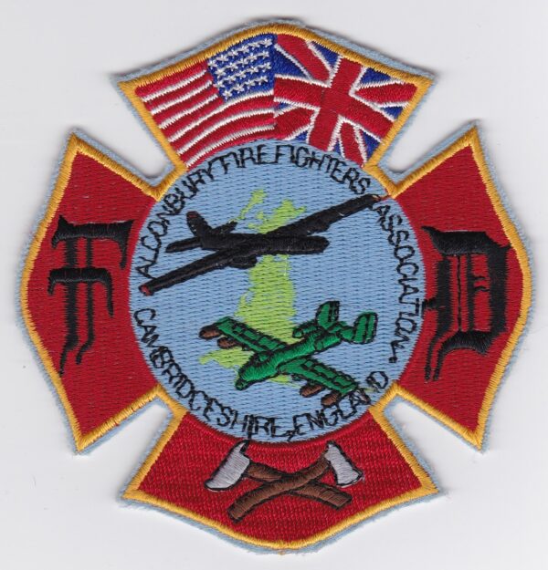 A firefighter's badge with the british flag on it.