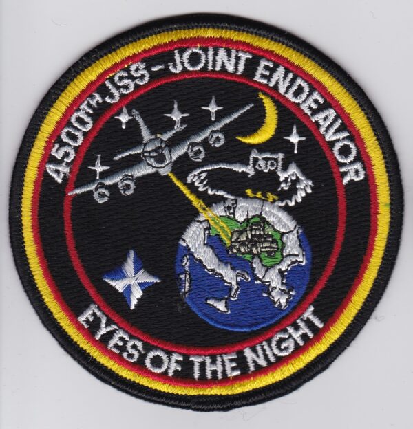 A patch with the words eyes of the night on it.