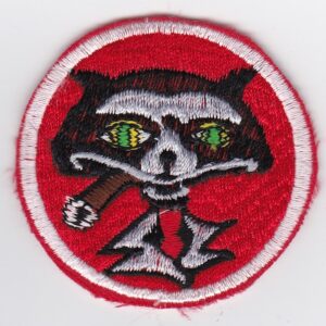 A red patch with an image of a raccoon on it.