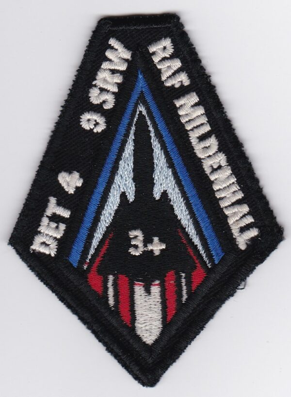 A patch with a red, white and blue design.