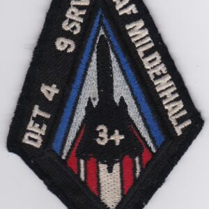 A patch with a red, white, and blue design on it.