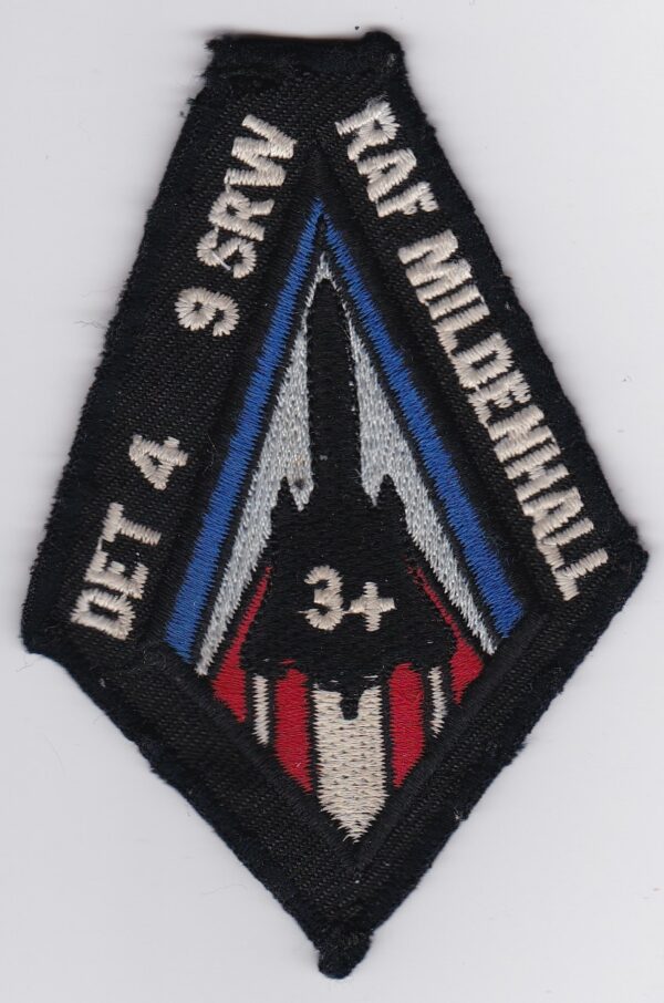 A patch with a red, white, and blue design on it.