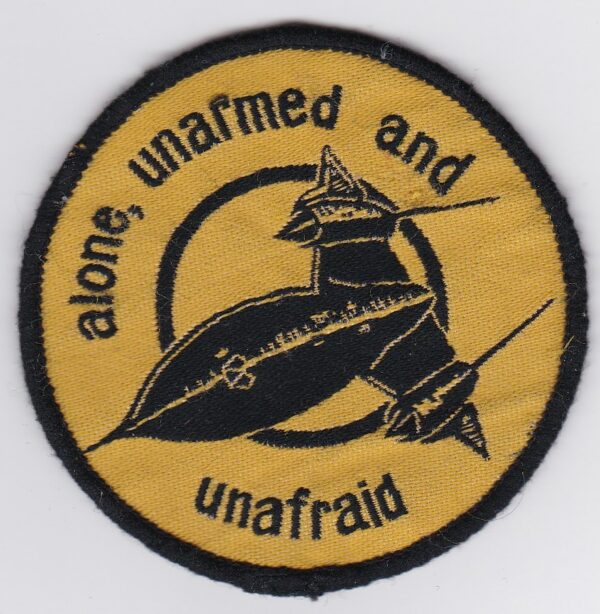 A patch with the words alone unarmed and unarmed.