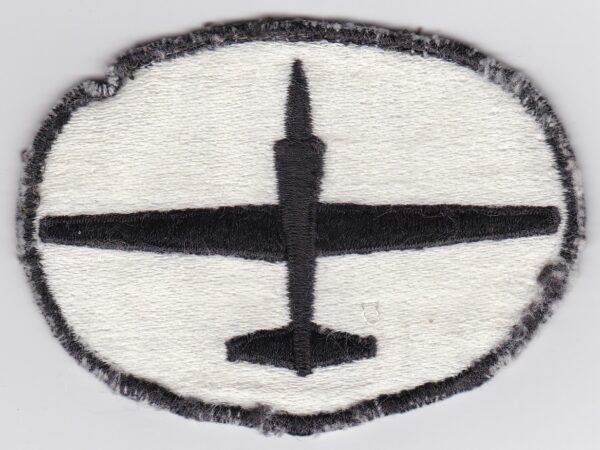 A black and white patch with a plane on it.