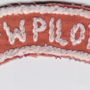 An orange and white embroidered patch.