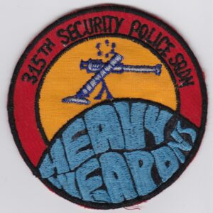 A patch with the words heavy weapons on it.